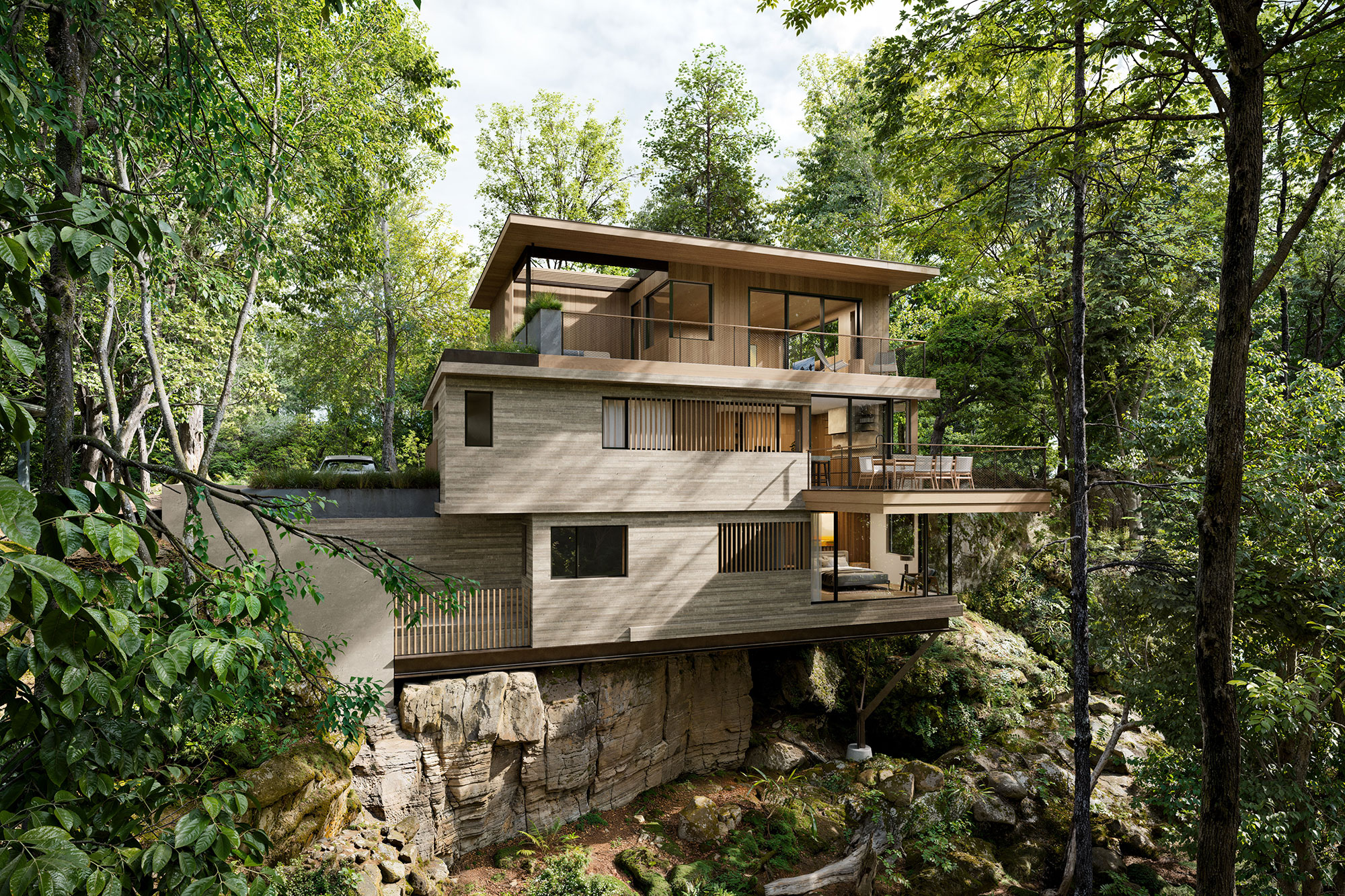 3 story modern house cantilevered over the edge of a ravine, stone cladding with a flat roof and outdoor decks