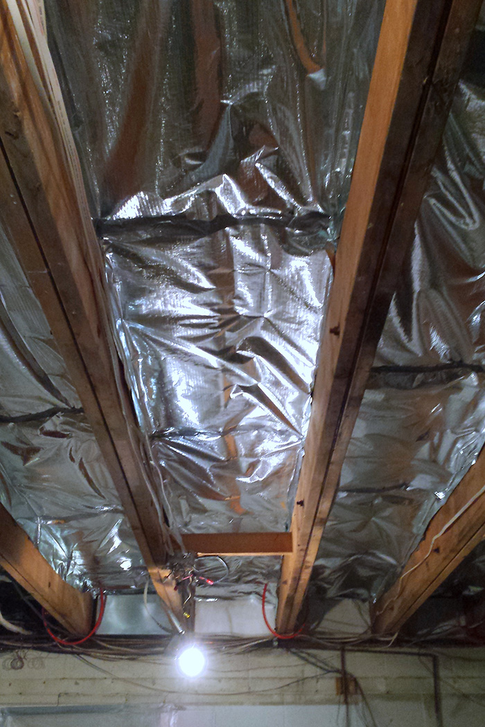 Radiant system reflective barrier